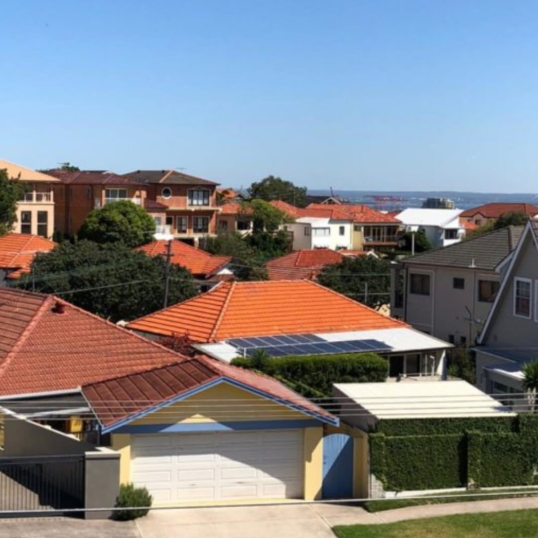Sydney suburban rooftops with terracotta tiles